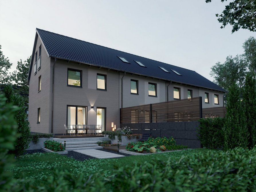 Reihenhaus Mainz 128 moderne Architektur mit vier Wohneinheiten Abendansicht Neubau Reihenhaus Mainz 128 mit vier Wohneinheiten bei Abendlicht Gartenansicht mit beleuchteten Fenstern